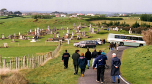 Massey University students visiting the site of the Wahi Redoubt, near Hawera, with cemetery alongside in which many of the Armed Constabulary dead were buried (1868-1869).