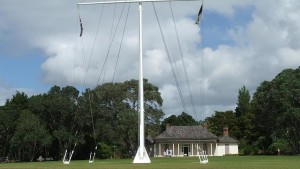 The flag pole, and Treaty House, at Waitangi. The Union Jack flag was raised here on 6 February, 1840. 