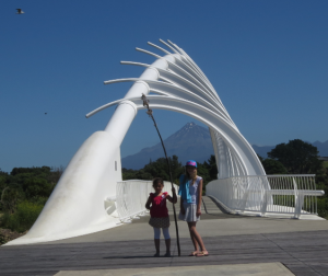 Bella and Anais standing by the Whaka Rewarewa Bridge, New Plymouth. The bridge crosses the Waiwakaiho River near the historic Whaka Rewarewa Pā.