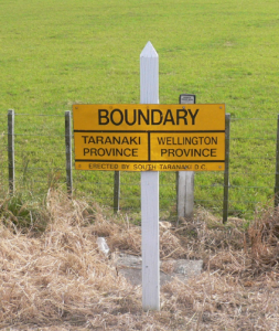 A relic of yesterday - signpost denoting boundary (abolished 1876) between Provincial Governments of Wellington and Taranaki. Signpost is just south of Patea. 