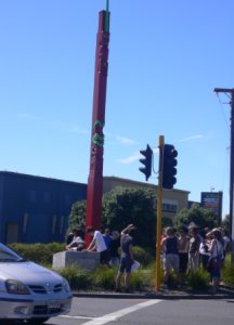 Te Pou Tuataki - FitzRoy's pole - today, standing on a busy highway corner near a large shopping arcade.