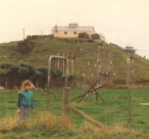 Lauren standing beneath the Parihaka Stockade, photo taken about 1988. Te Whiti and Tohu were held in this stockade, after their arrest, on their way to trial in New Plymouth. 