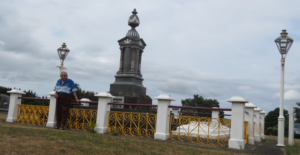 Rangikotuku stands by the tomb of his great-grandfather, Te Whiti O Rongomai, at Parihaka in early 2015.